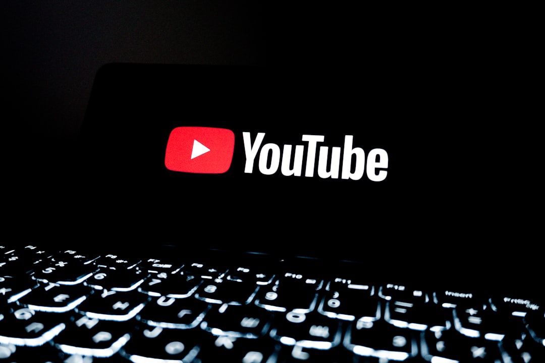 youtube-logo-displayed-on-a-dark-screen-above-keyboard-ulphh-frgco